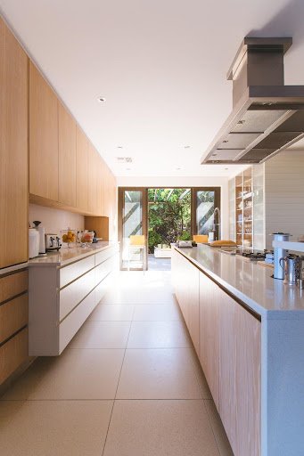 Galley kitchen with beautiful tile flooring